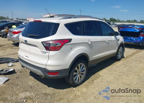 2017 Ford Escape Titanium z USA, uszkodzony, nr VIN 1FMCU9JD7HUA31317
